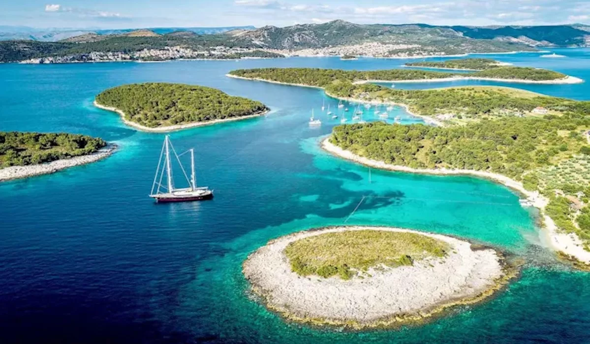 Yacht sailing near shore